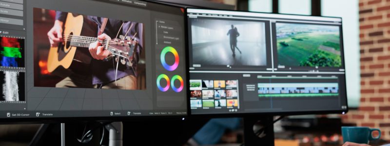 professional-video-editor-sitting-at-multi-monitor-workspace